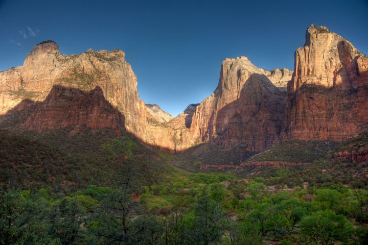 shadow over mountains with blue sky