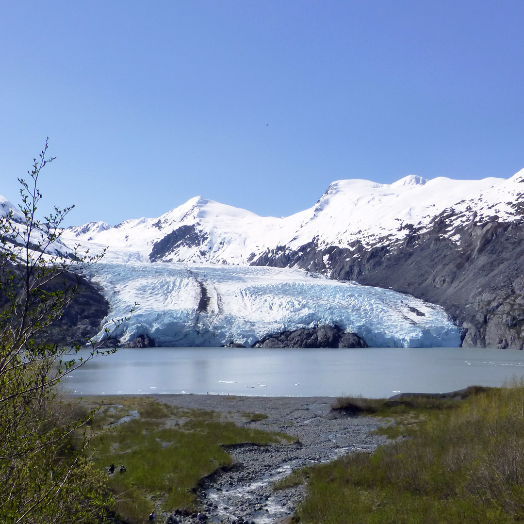 a body of water in front of portage glacier