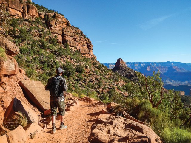 hiker walkinga long the bright angel trail in grand canyon national park
