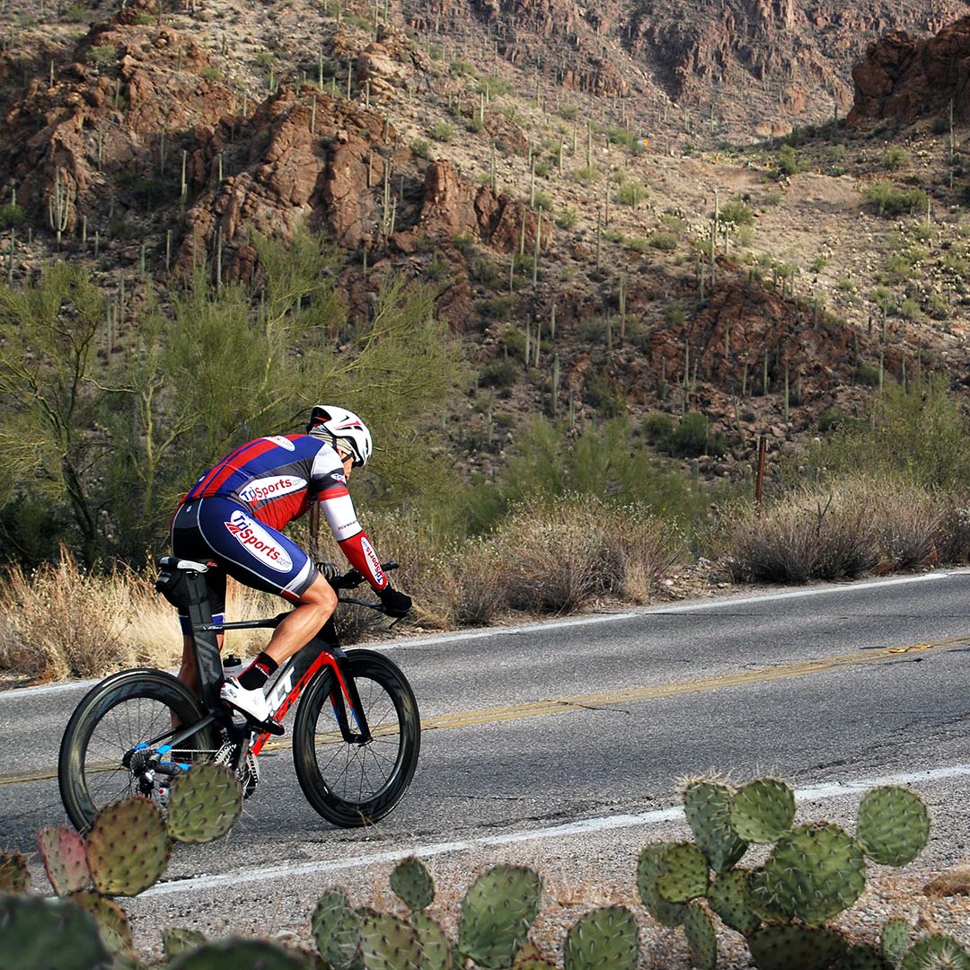 A cyclist riding in Tucson Mountain Park. Photo © Tim Hull.