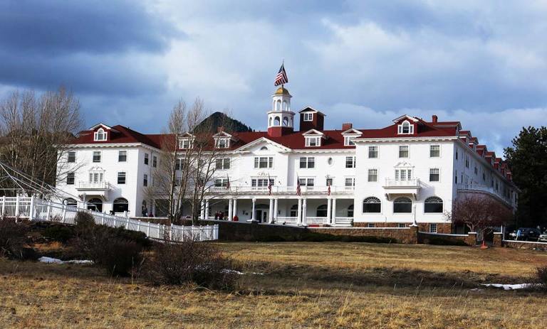 cloudy sky over a white hotel building