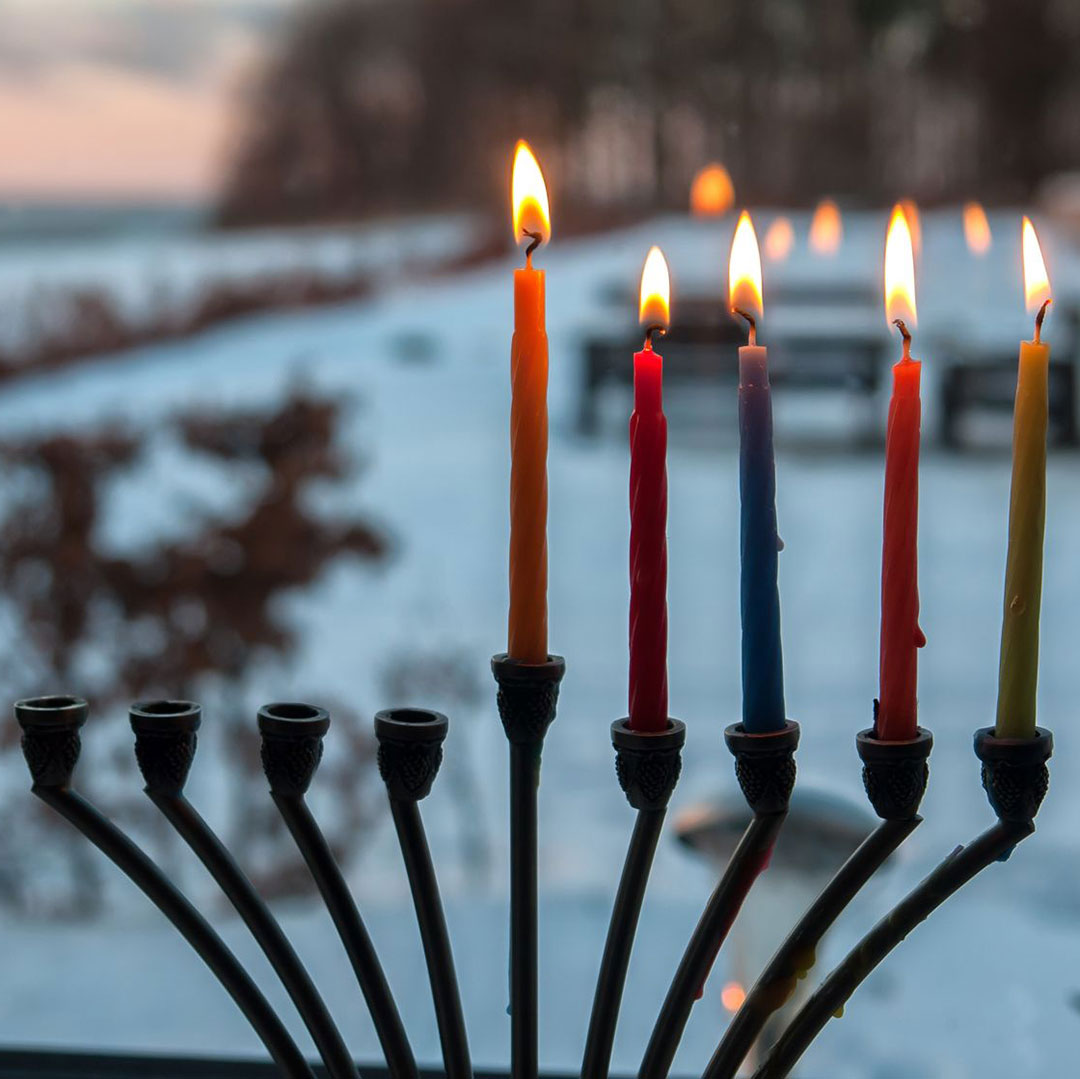 Menorah displayed in a window. Photo © Ron Zmiri/123rf.