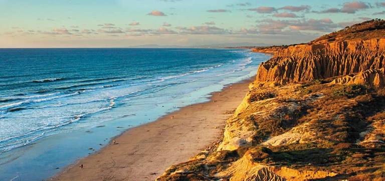 ocean waves on the beach during sunset