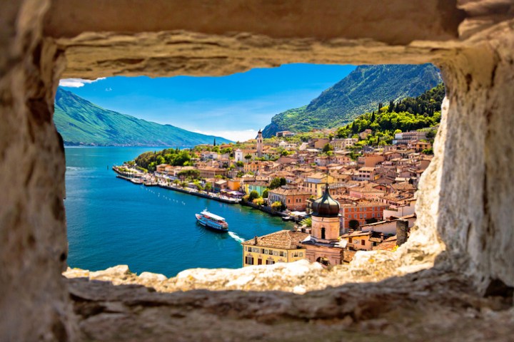 Limone sul Garda view through stone window from hill, Garda lake in Lombardy region of Italy