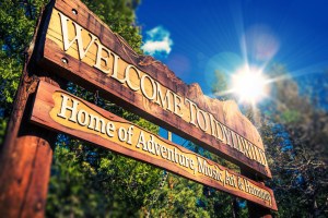 Sign that reads: Welcome to Idyllwild: Home of Adventure, Music, Art & Harmony