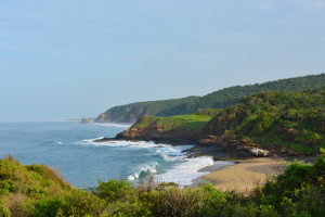 Photo of Mazunte with clear blue water and blue skies